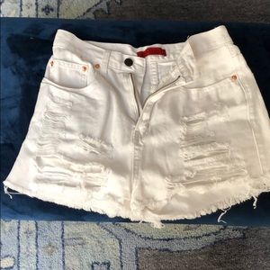 White ripped jean shorts